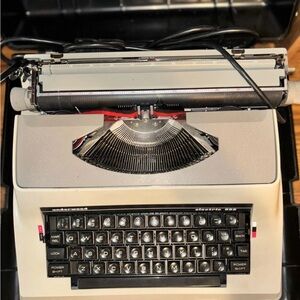 Vintage Typewriter with Black and Cream Design